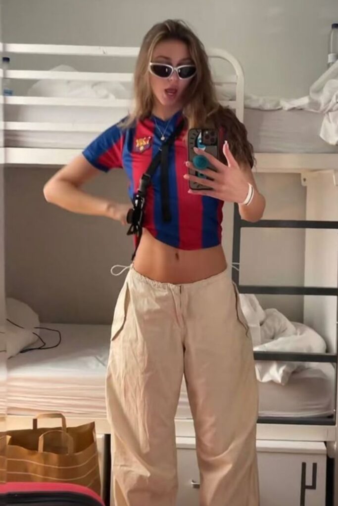 cropped football shirt and baggy trousers