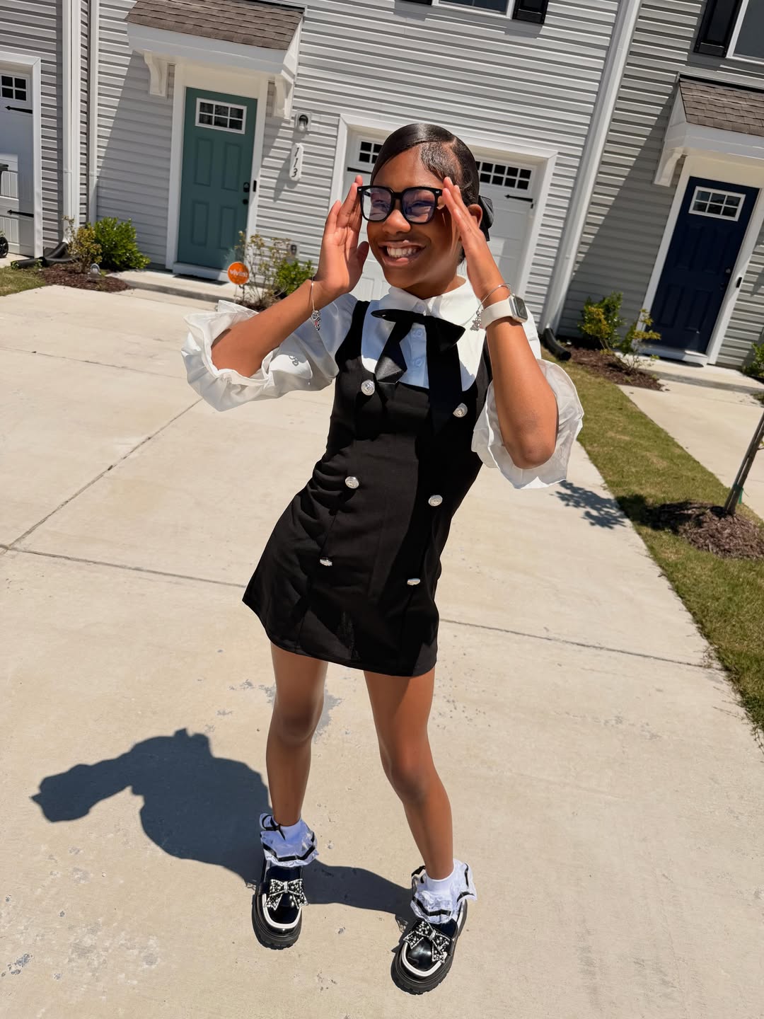 Black Pinafore Dress With Frilly Blouse & Bow Shoes