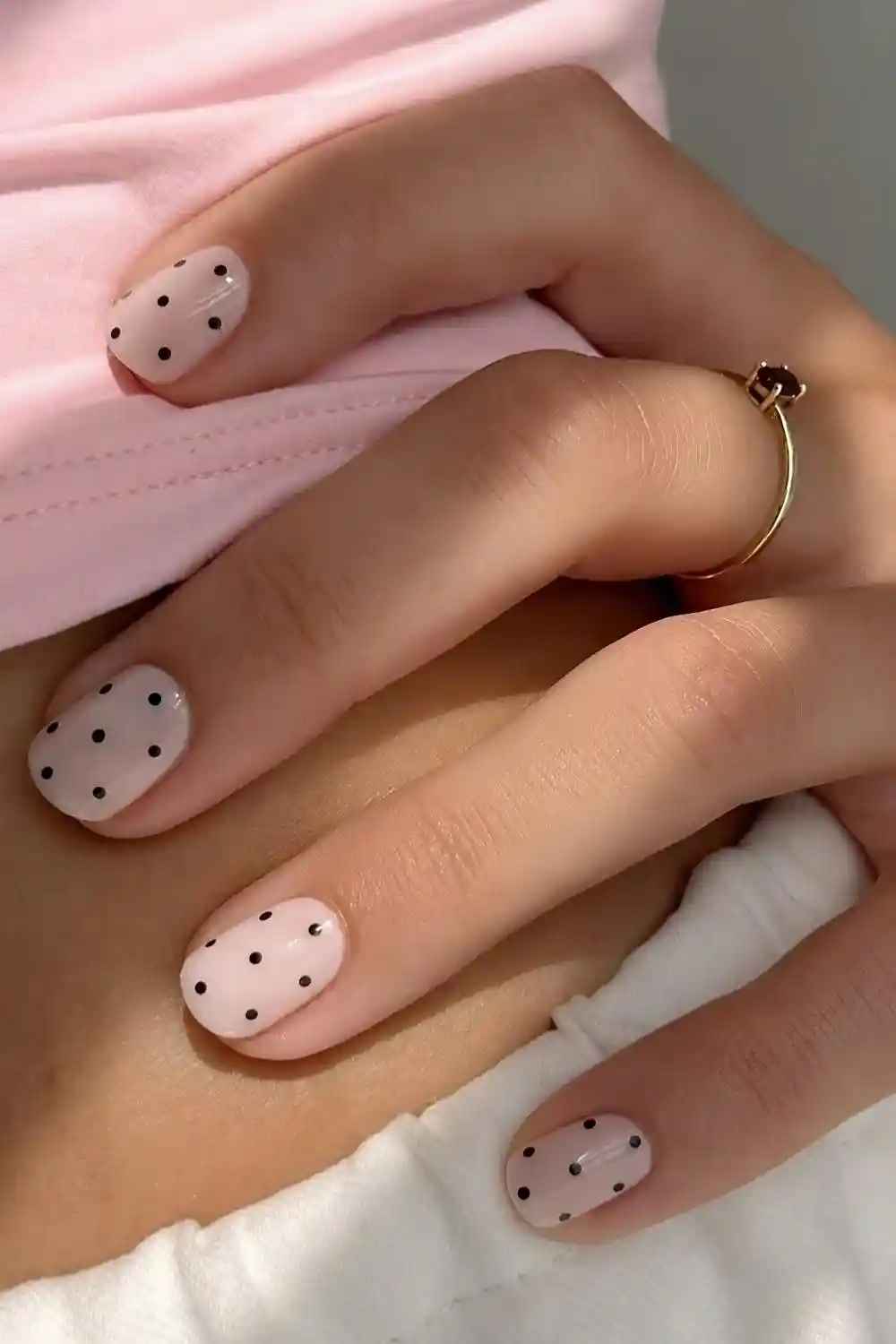 Short white nails with black polka dots
