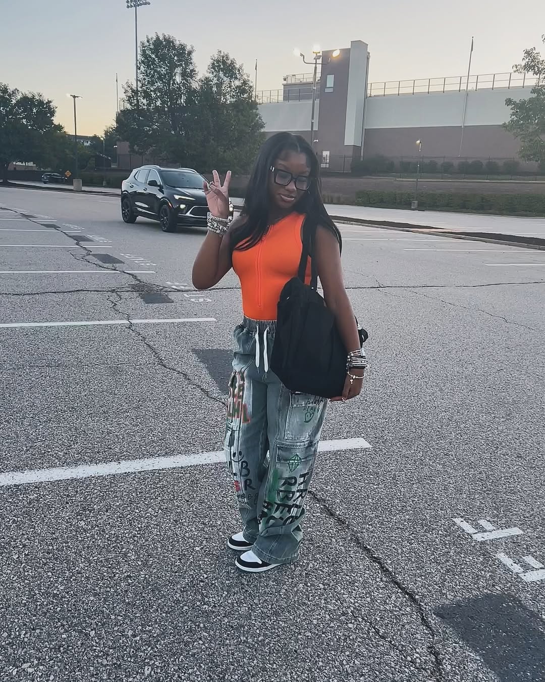 Graphic Cargo Jeans With Orange Zip Up Top