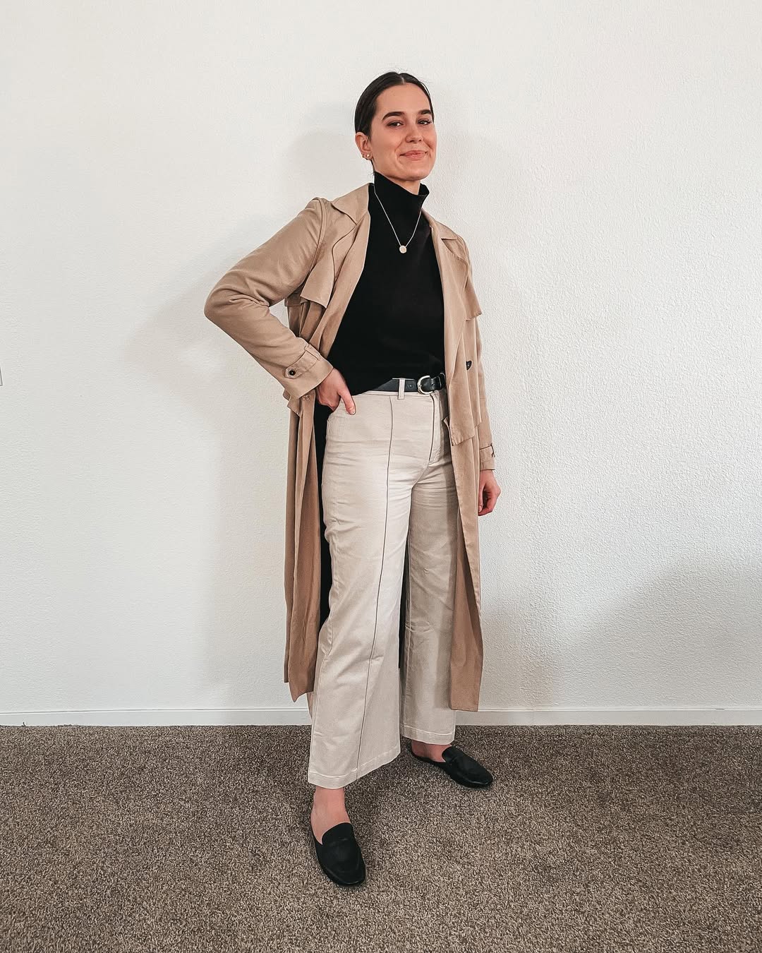 Tan Trench Over Black Turtleneck and Cream Wide-Leg Pants