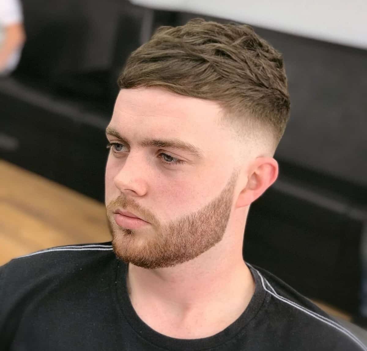 Messy textured french crop with mid fade haircut for guys
