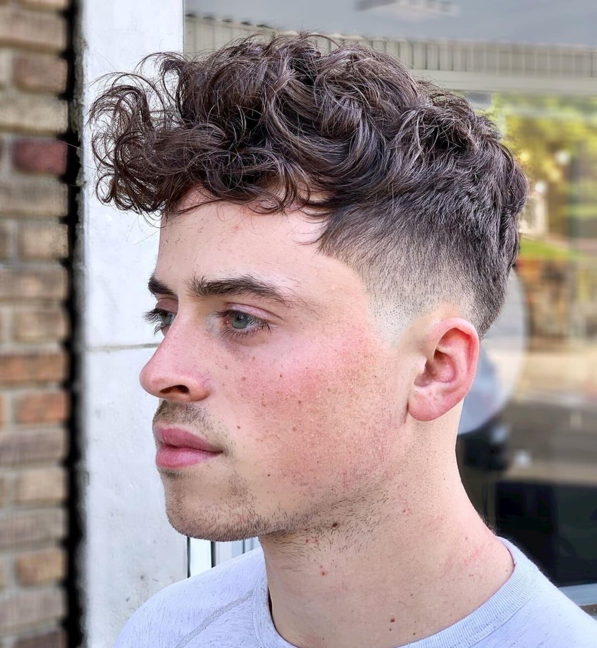 Mens curly mess on top with tapered sides