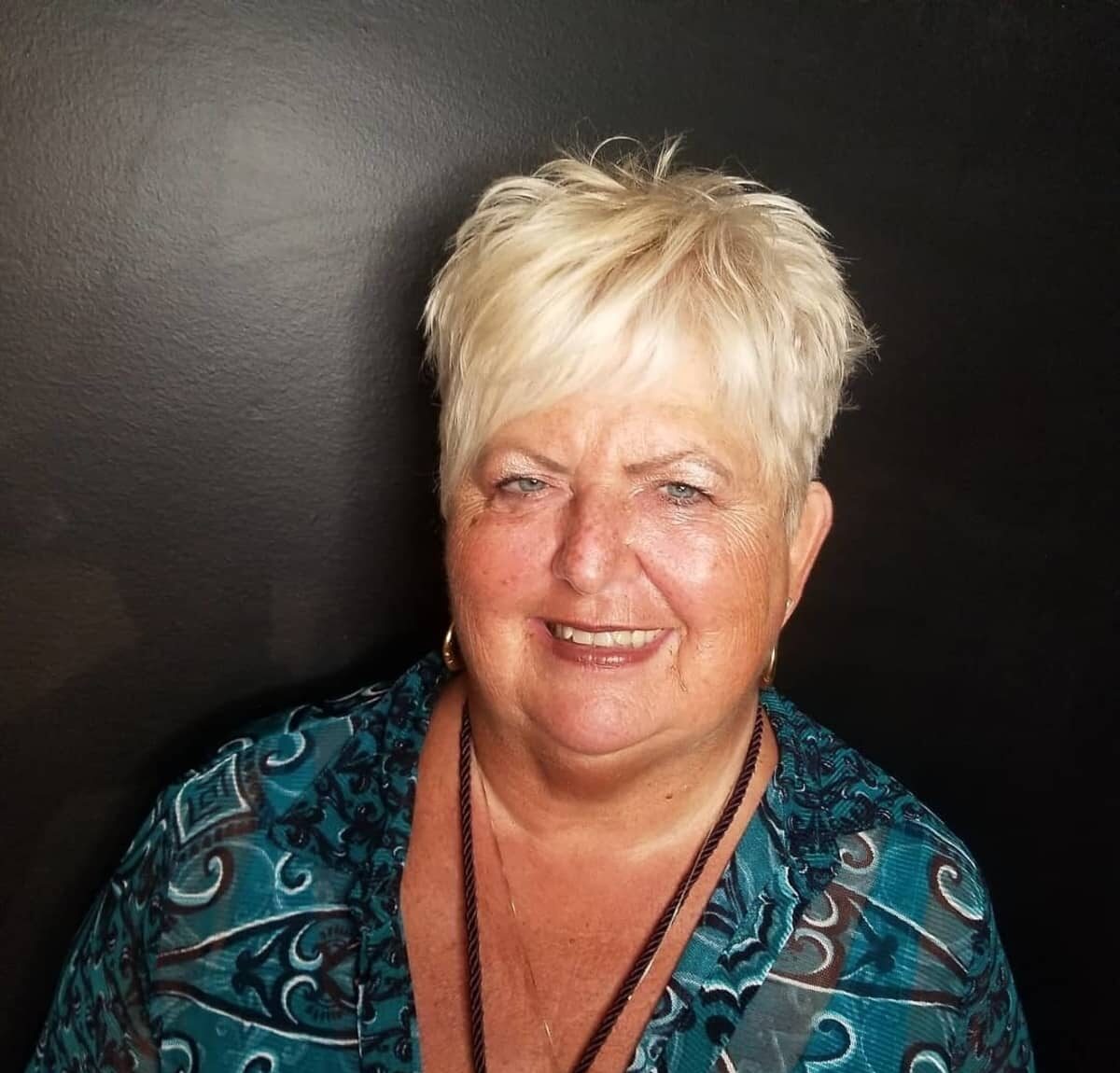 Asymmetrical short cut that's Messy and Spiky for women over 60 with Round Faces