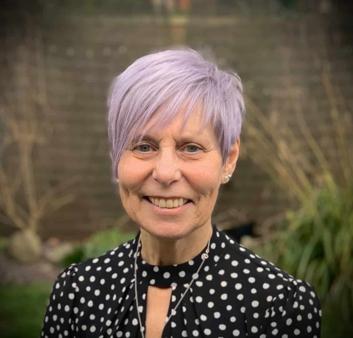 Woman over 60 with a Purple Pixie and Bangs