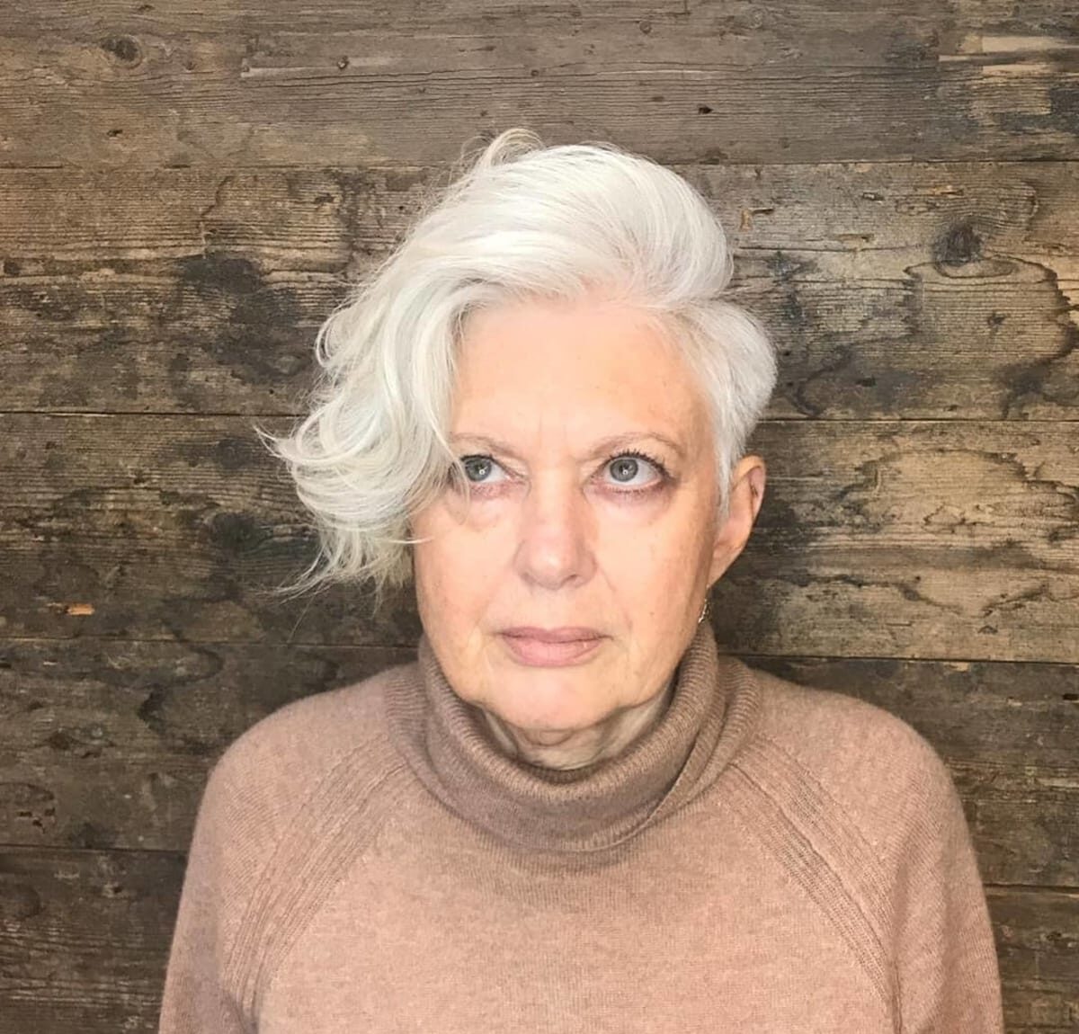 Long Asymmetrical Pixie with a Side Part for women turning 60