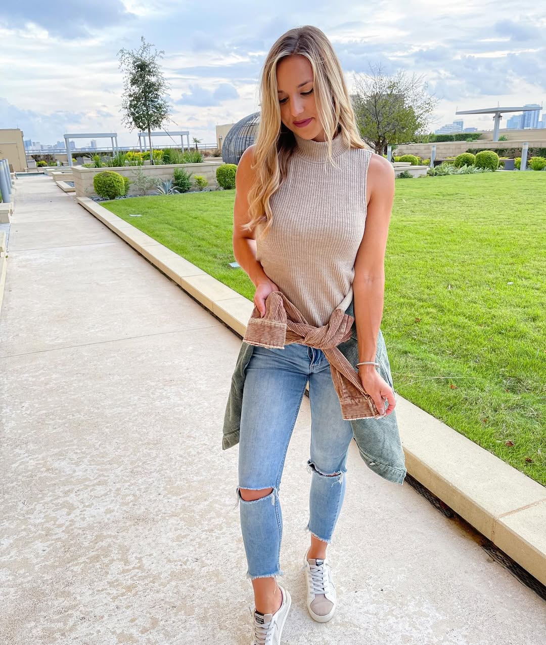 Neutral Ribbed Turtleneck With Distressed Denim