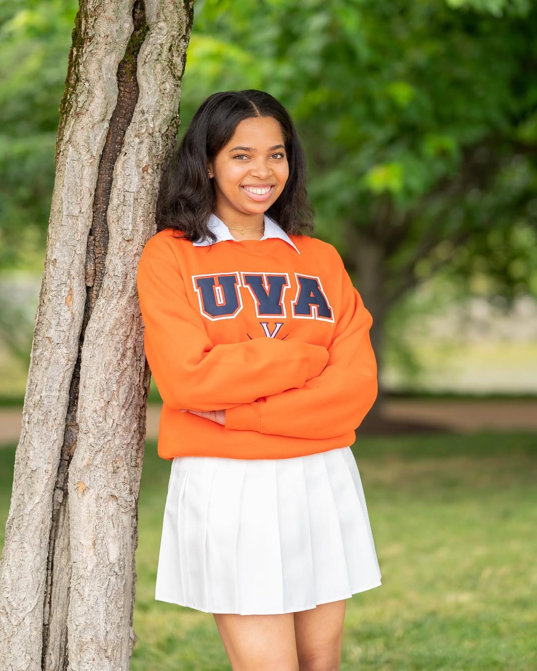 Orange Sweatshirt and White Pleated Skirt Look