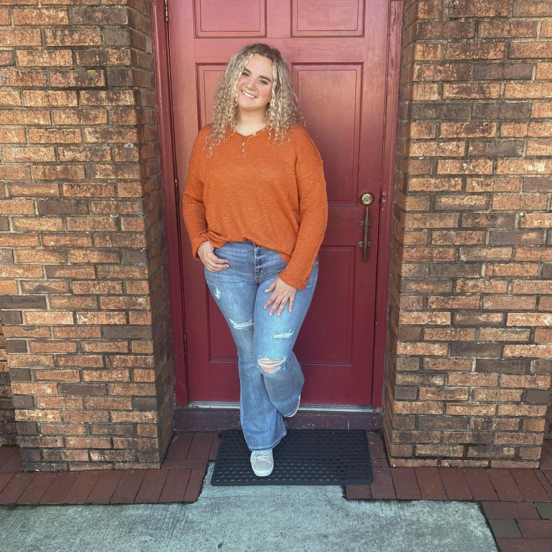 Cozy Terracotta Sweater And Distressed Denim Look
