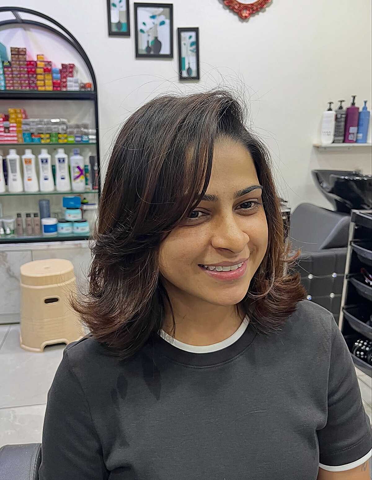 25 Below-the-Chin Bob Hairstyles Taking Over Salons Layered dark brown bob with face-framing flipped ends