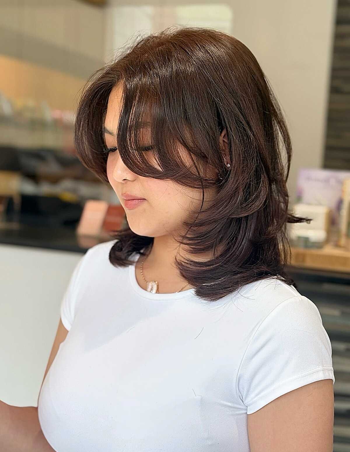 Dark brown layered shag blowout with side bangs