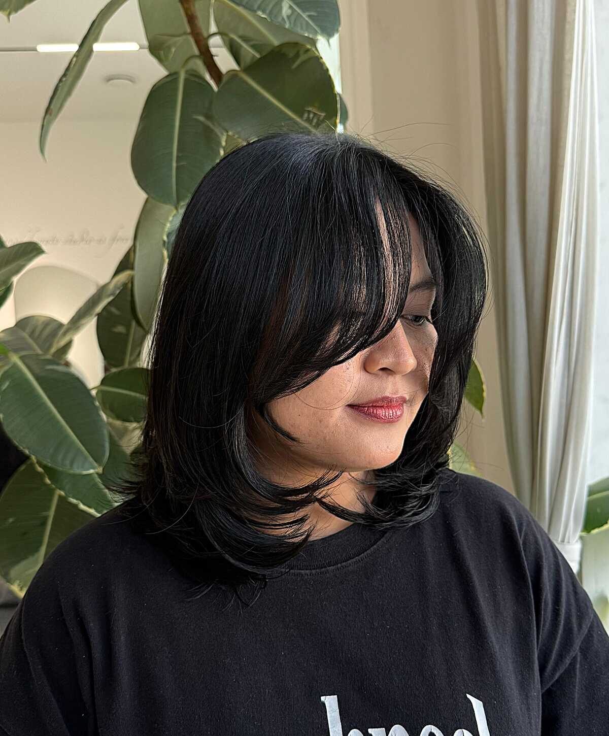 Jet black mid-length blowout with flipped ends