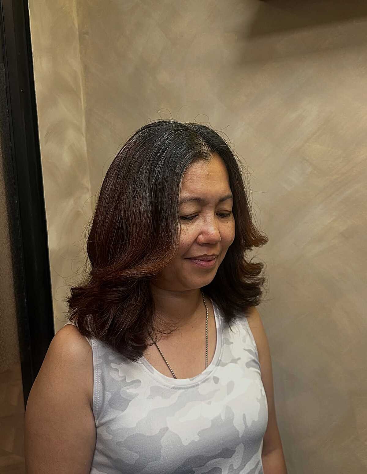 Dark brunette blowout with curled under ends
