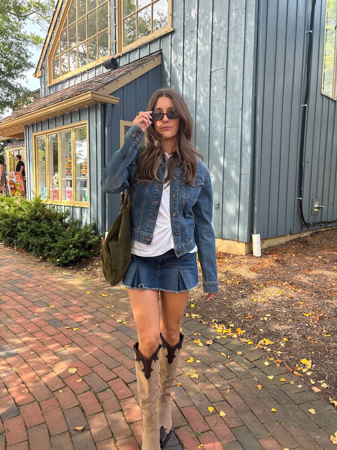 Denim Jacket Pleated Mini Skirt Cowboy Boots Outfit