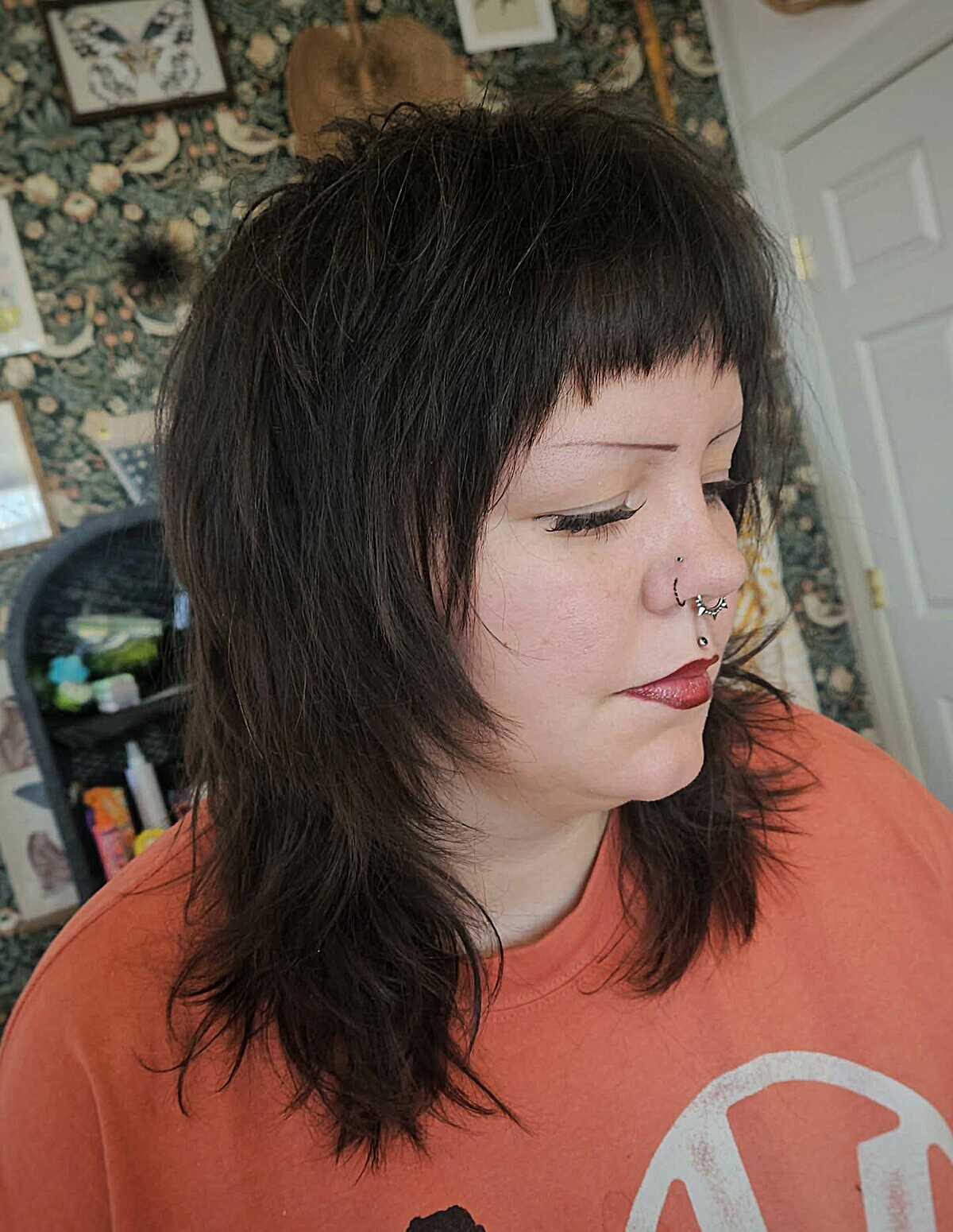 Dark brown choppy shag with short baby bangs