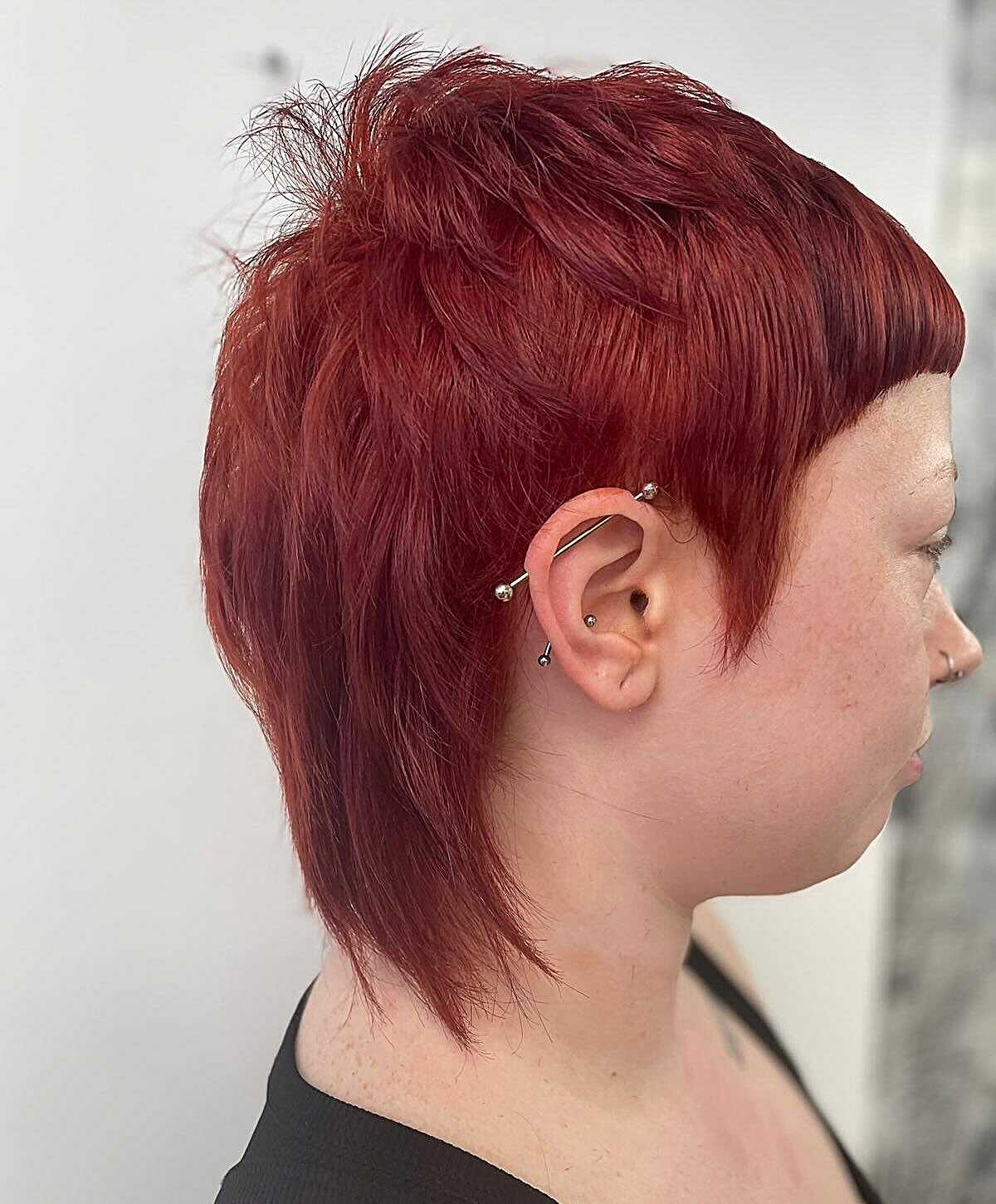 Short textured pixie in deep crimson red