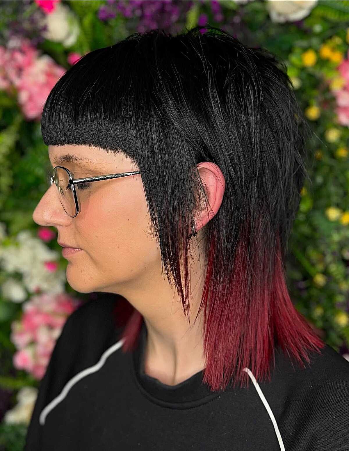 Black bob with micro bangs and red-dipped ends