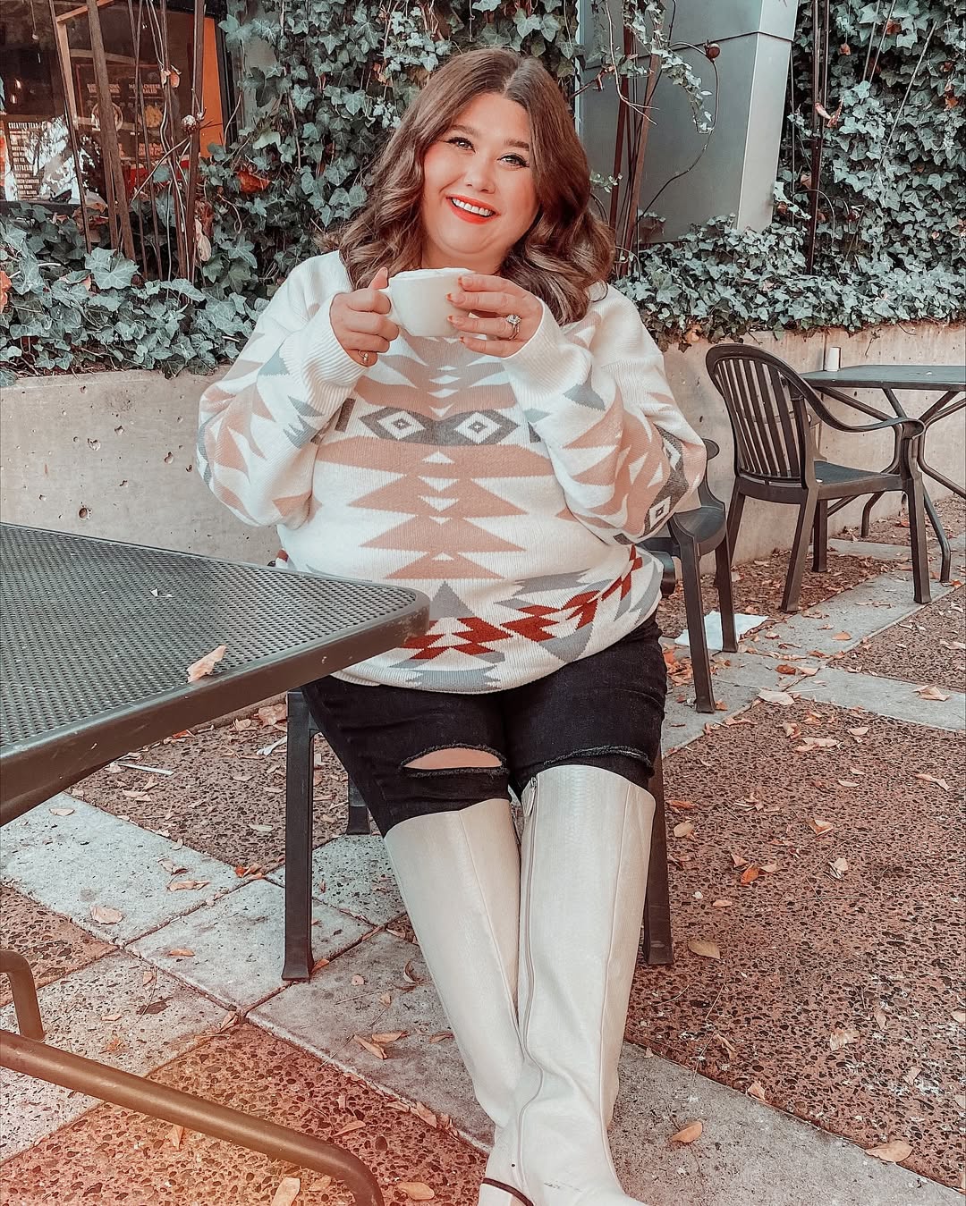 Graphic Print Sweater With Ripped Jeans And Boots