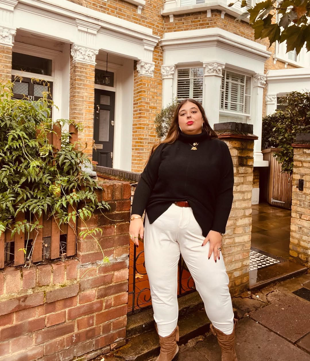 Chic Black Turtleneck With White Trousers Outfit