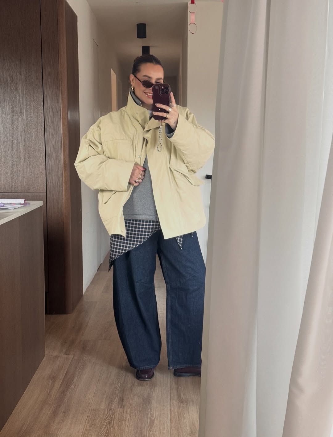 Oversized Puffer Layered Over Plaid Shirt Look