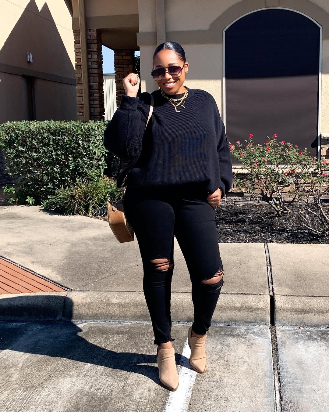 Chic Black Sweater With Ripped Jeans