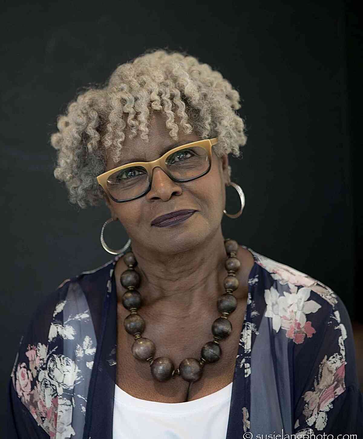 Ear-Length Mini Curly Bowl Cut with Layers for Older Black Women with Specs