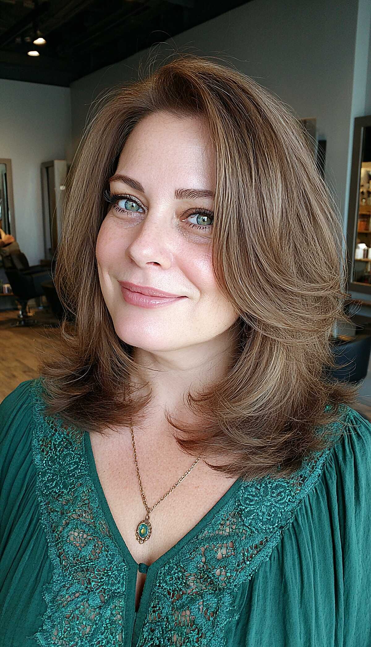 Caramel brunette layered lob with blowout styling