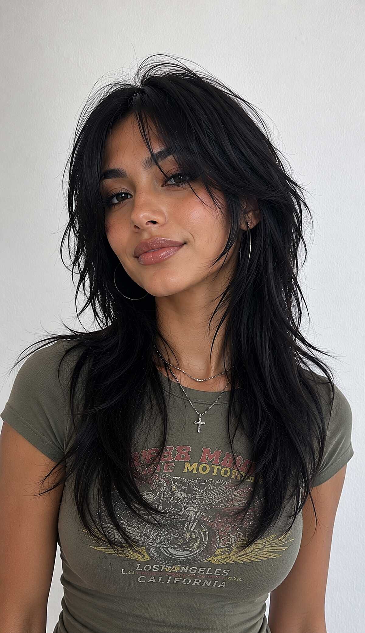 Jet black long wolf cut with soft razored bangs