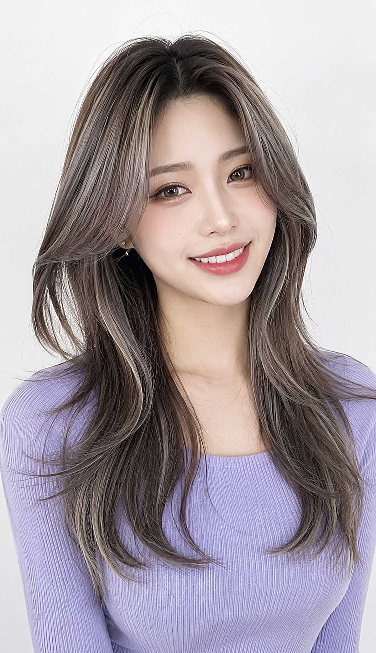 Ash brown long layers with a polished Korean blowout