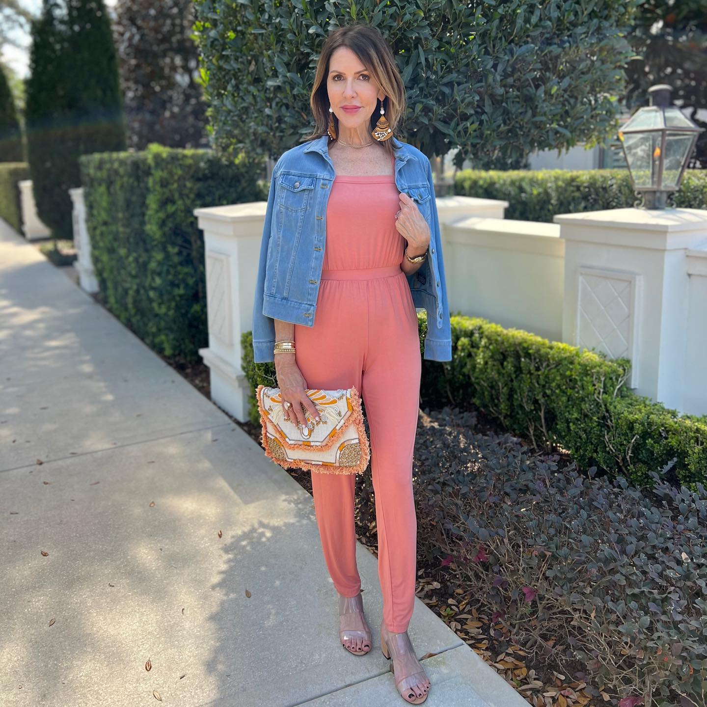 Denim Jacket Over Coral Jumpsuit Casual Chic
