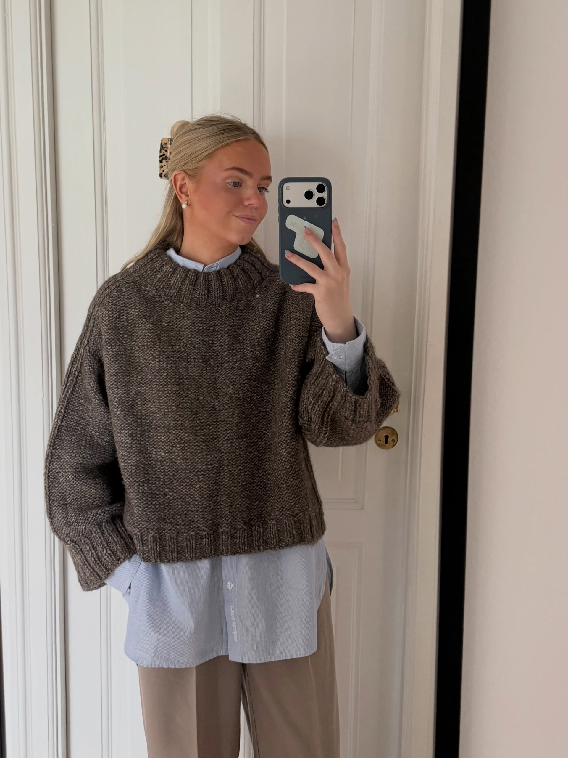Textured Knit Sweater Over Striped Button-Down