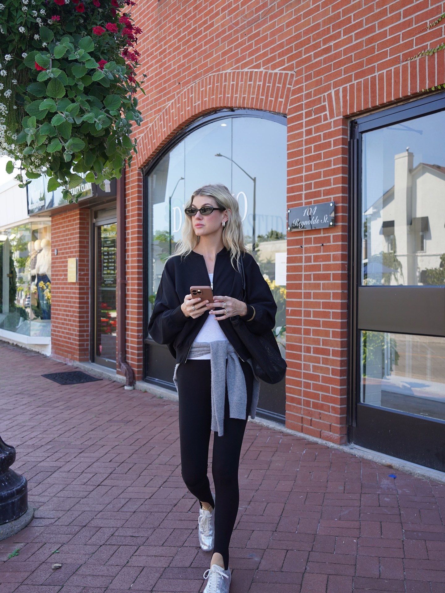 Effortless Black Athleisure Look With Metallic Sneakers