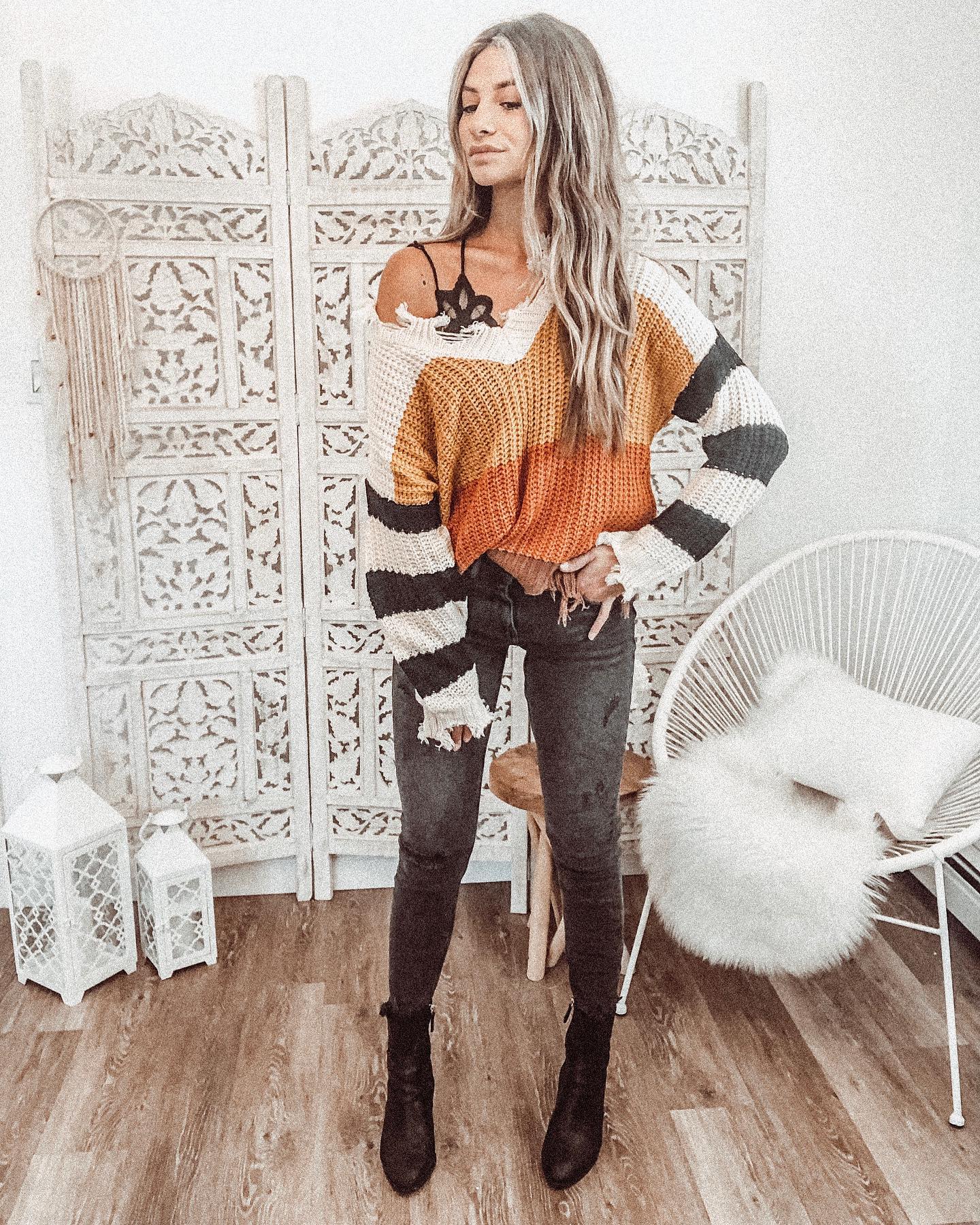 Striped Knit Sweater With Distressed Denim And Ankle Boots
