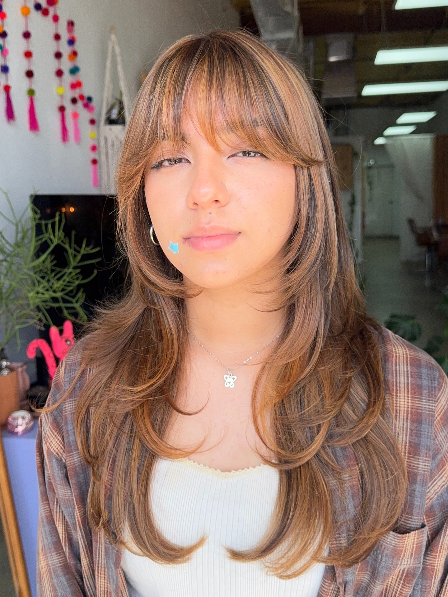 Layered Honey Blonde Cut With Wispy Bangs