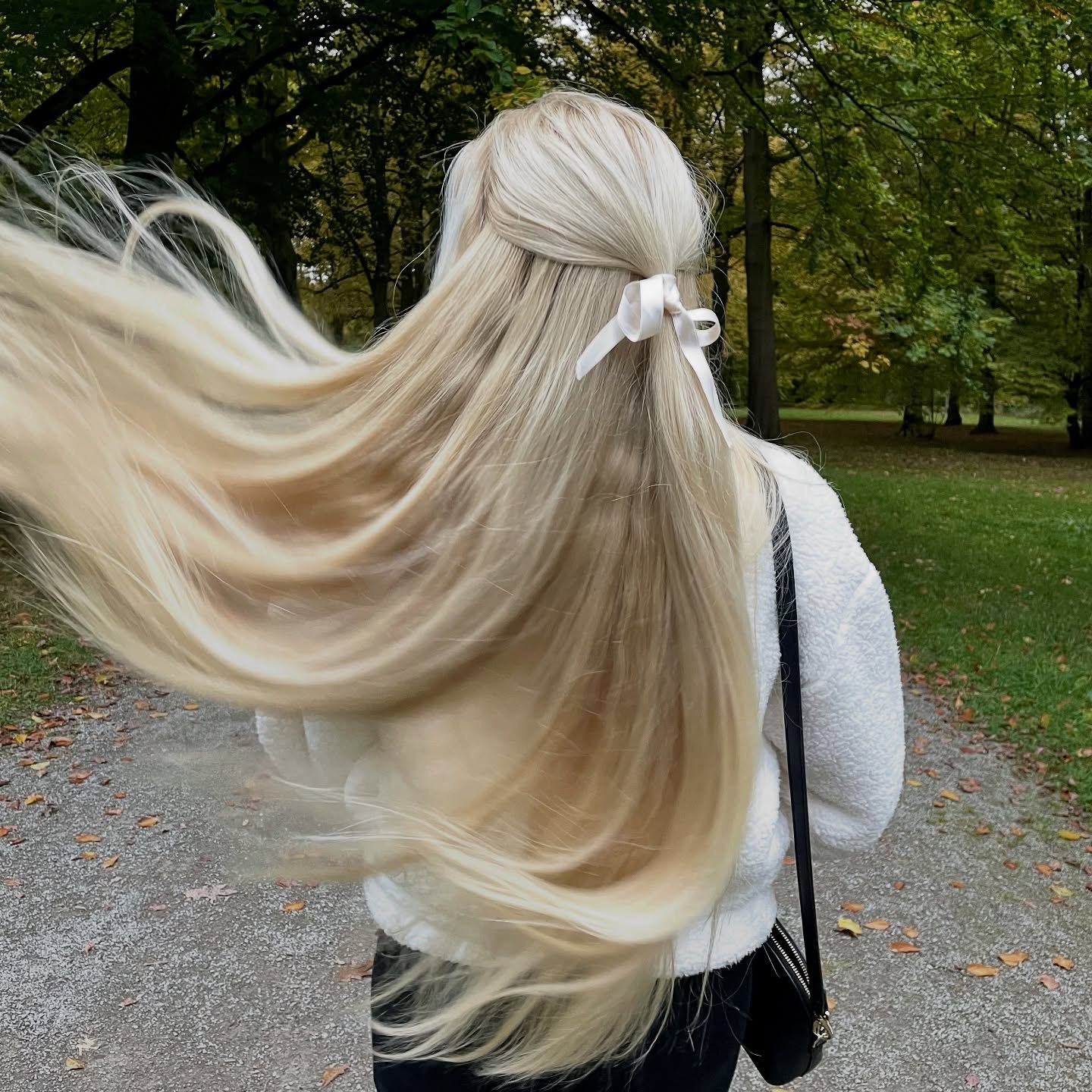 Cascading Blonde Waves With Ribbon Accent