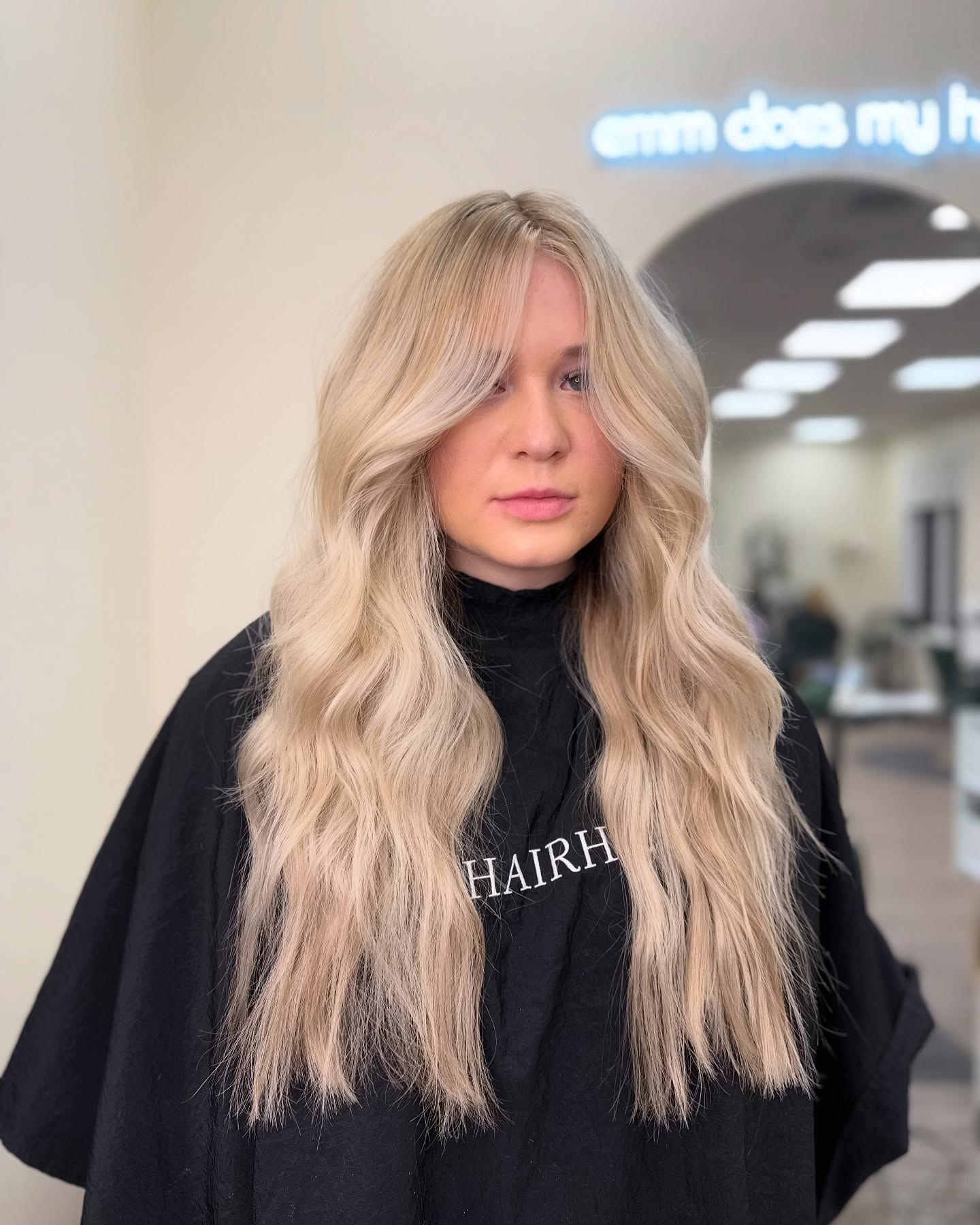 Sandy Blonde Waves With Face-Framing Layers