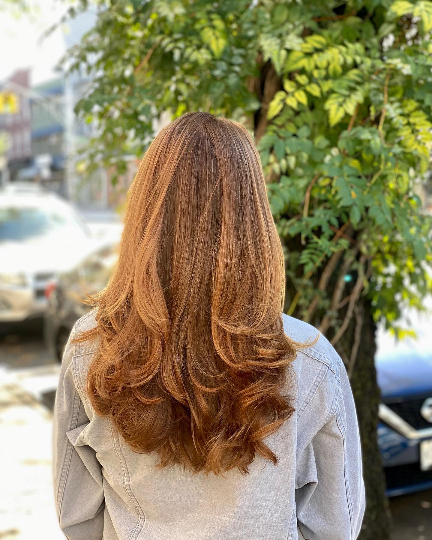 Warm Copper Layers With Voluminous Face-Framing Curls