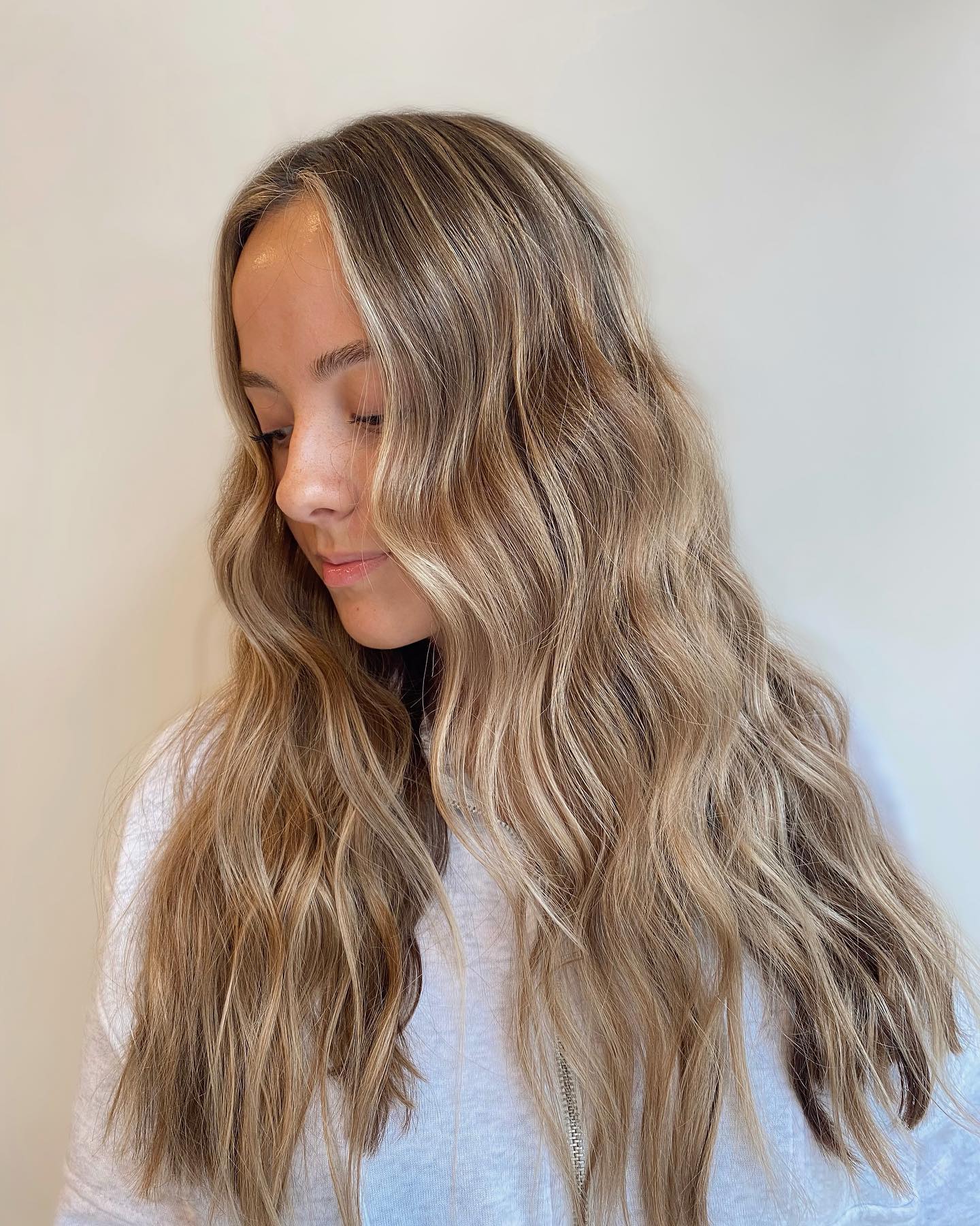 Sun-Kissed Honey Blonde Highlights On Brunette Waves
