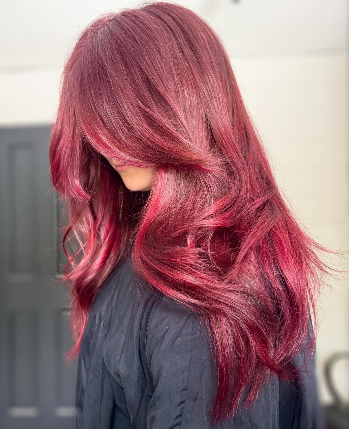 Bold Cherry Red Wavy Lob With Face-Framing Layers