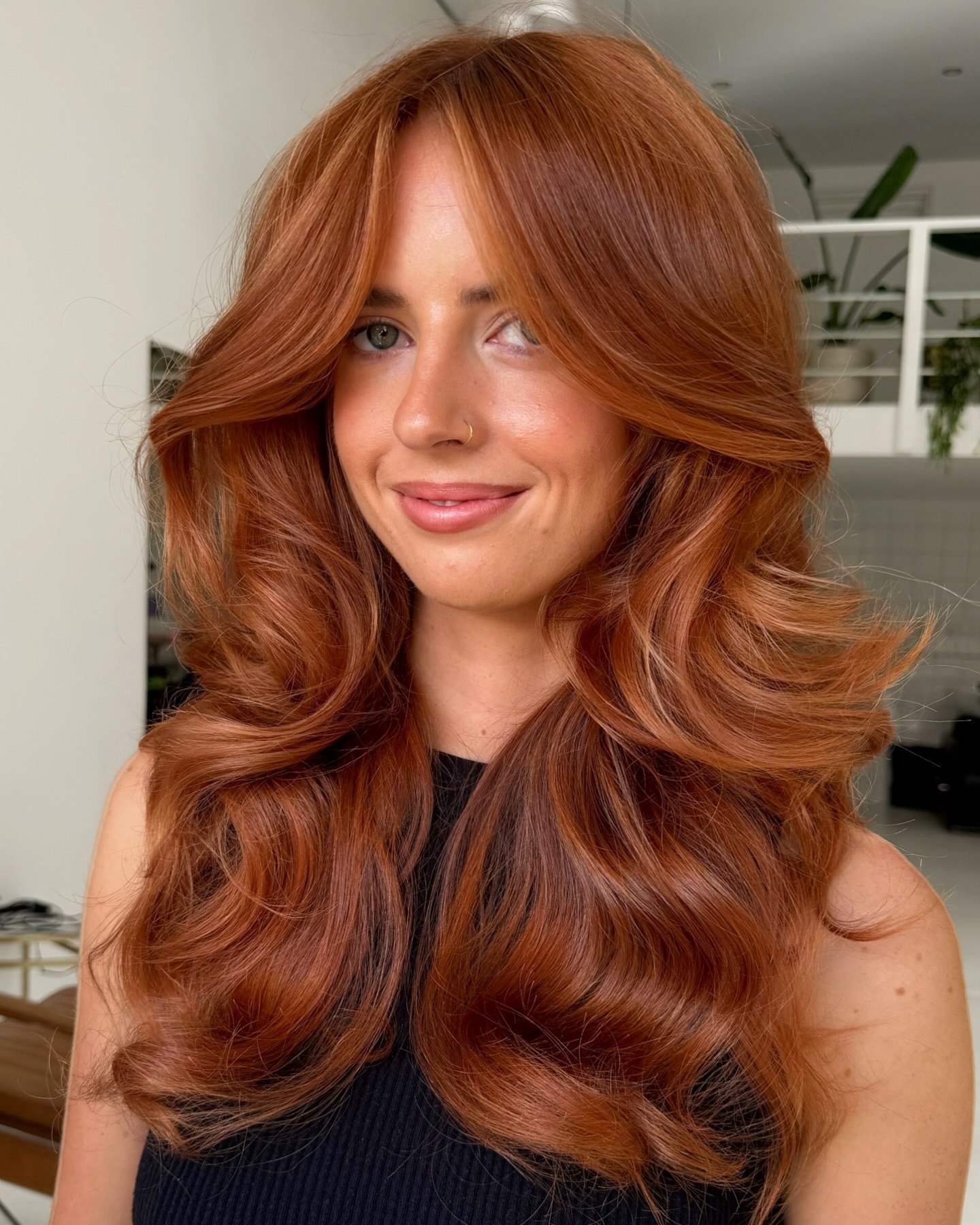 Copper Glow Voluminous Waves With Face-Framing