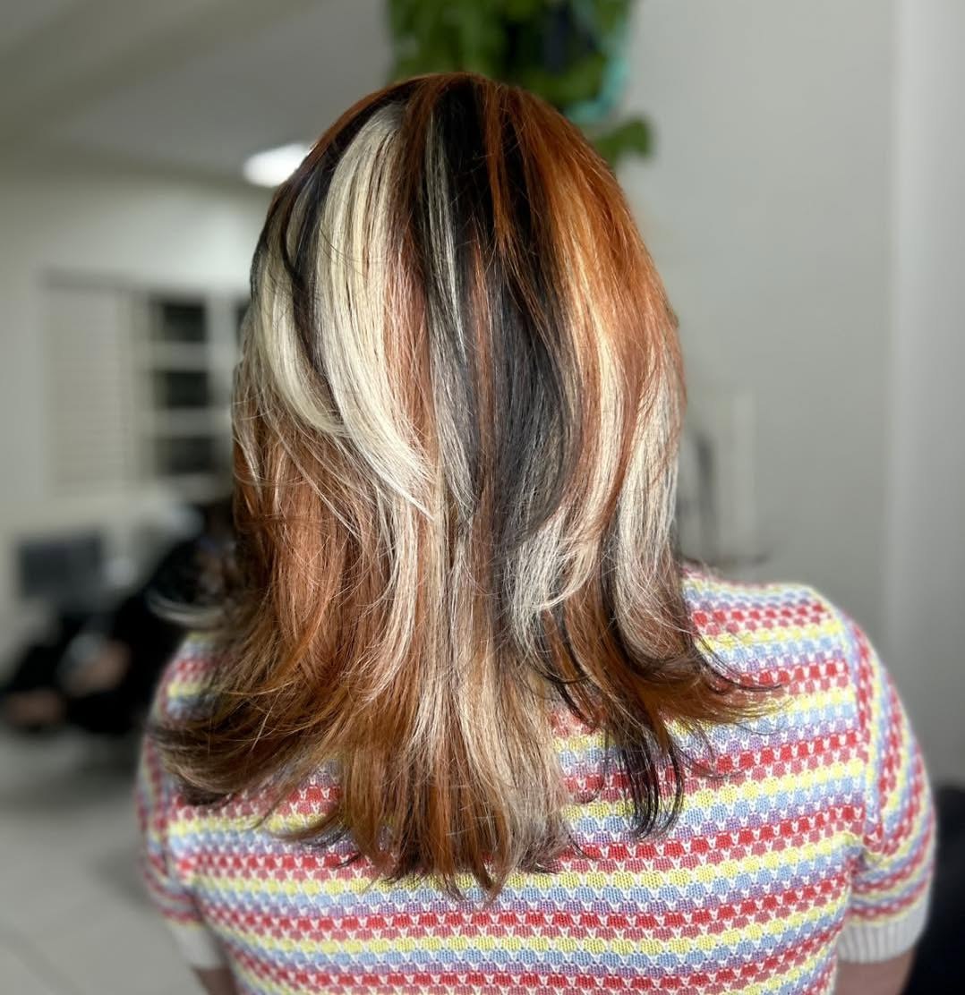 Bold Calico Hair Color With Subtle Layers