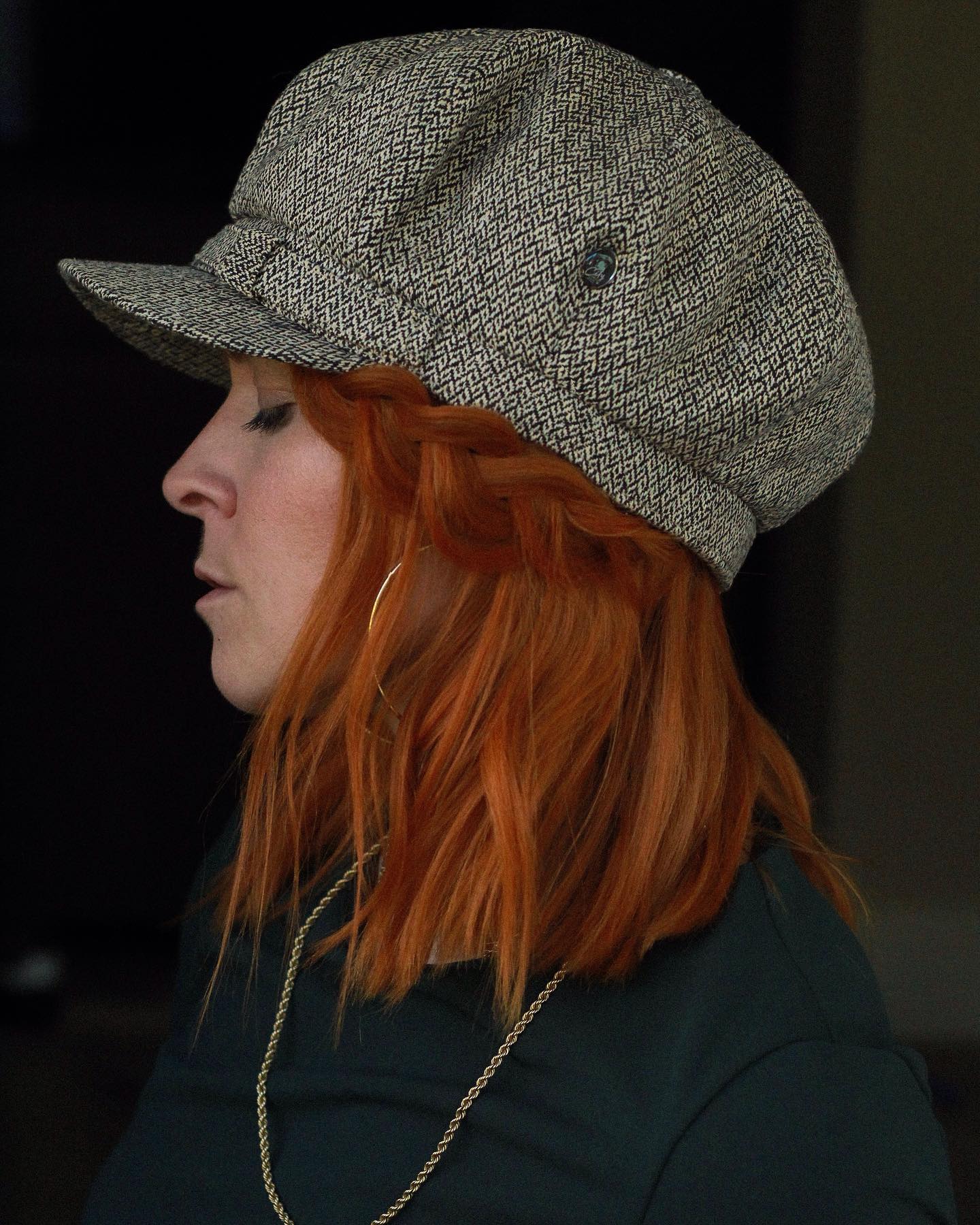 Crimson Braided Bob With A Tweed Cap