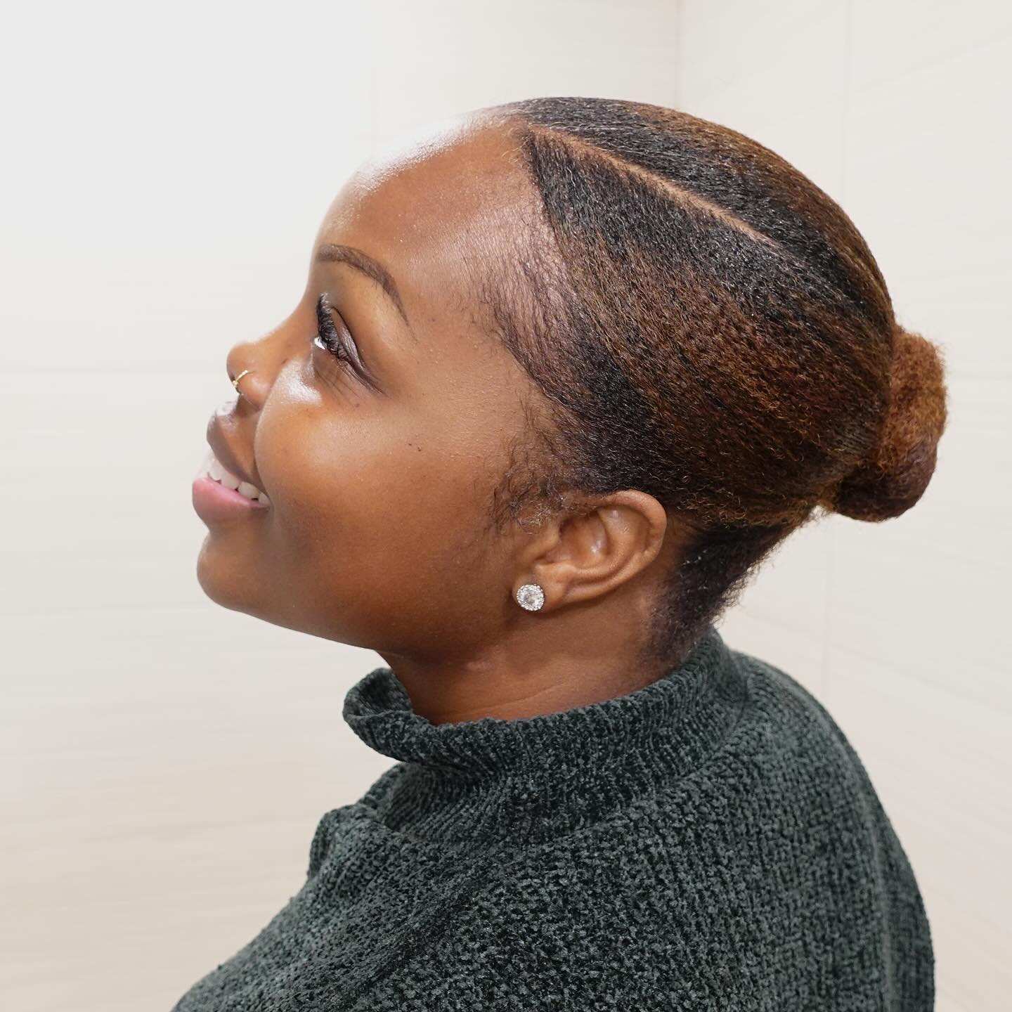 Sleek Low Bun With Defined Side Part