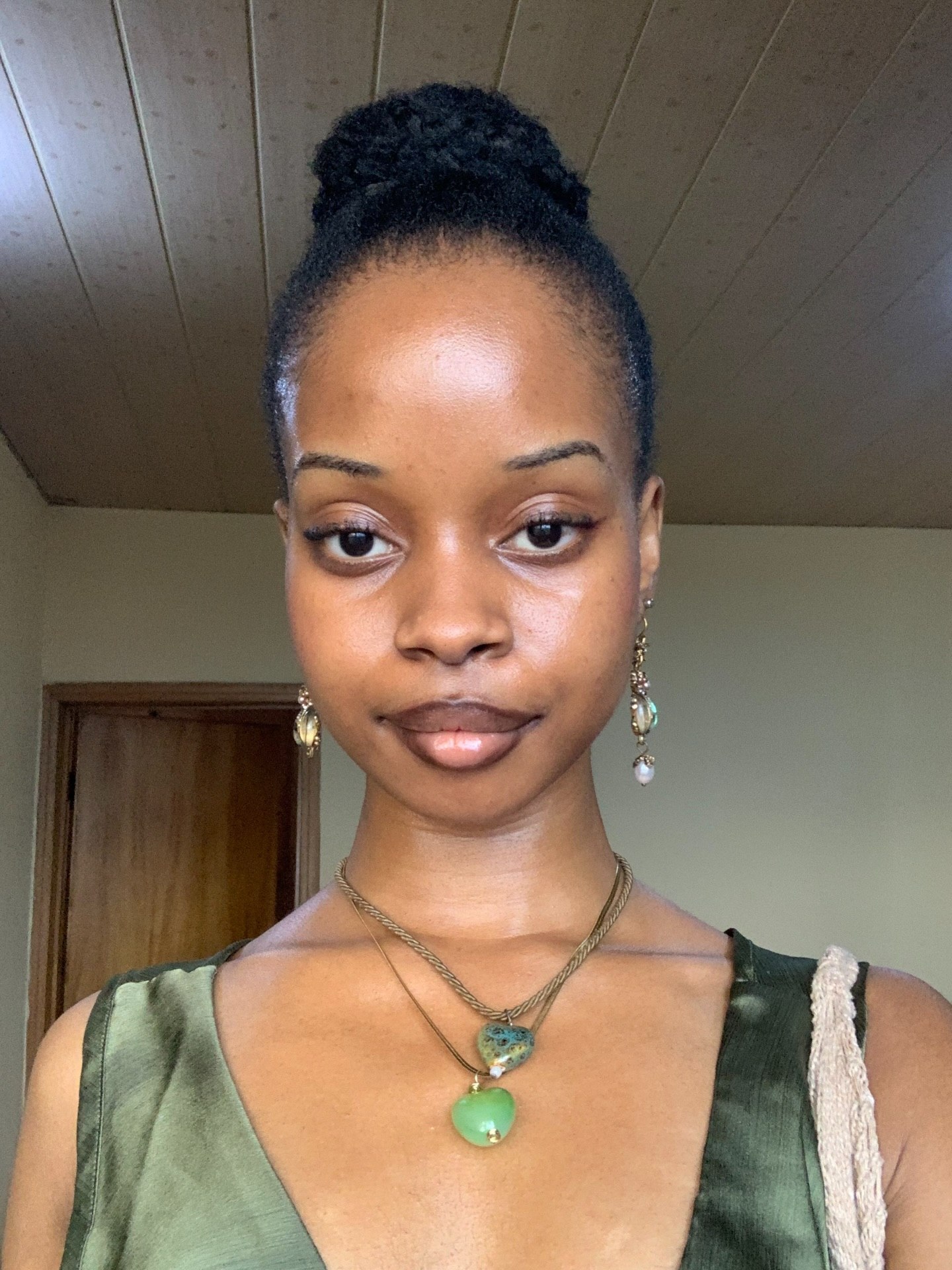 Sleek Top Knot With Defined Coils