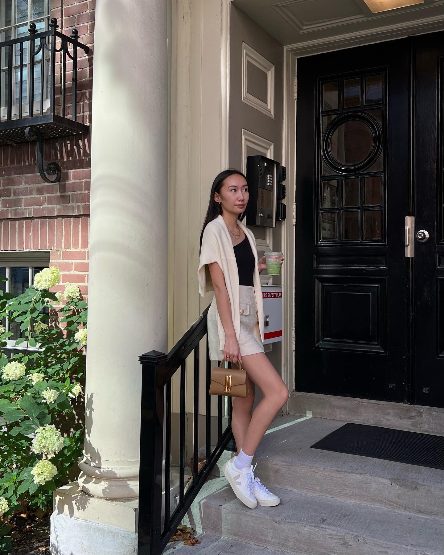 Cream Knit Cardigan Over Black Tank and Linen Shorts