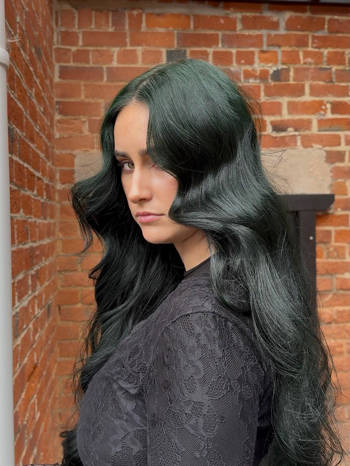 Deep Emerald Waves With Face-Framing Tendrils