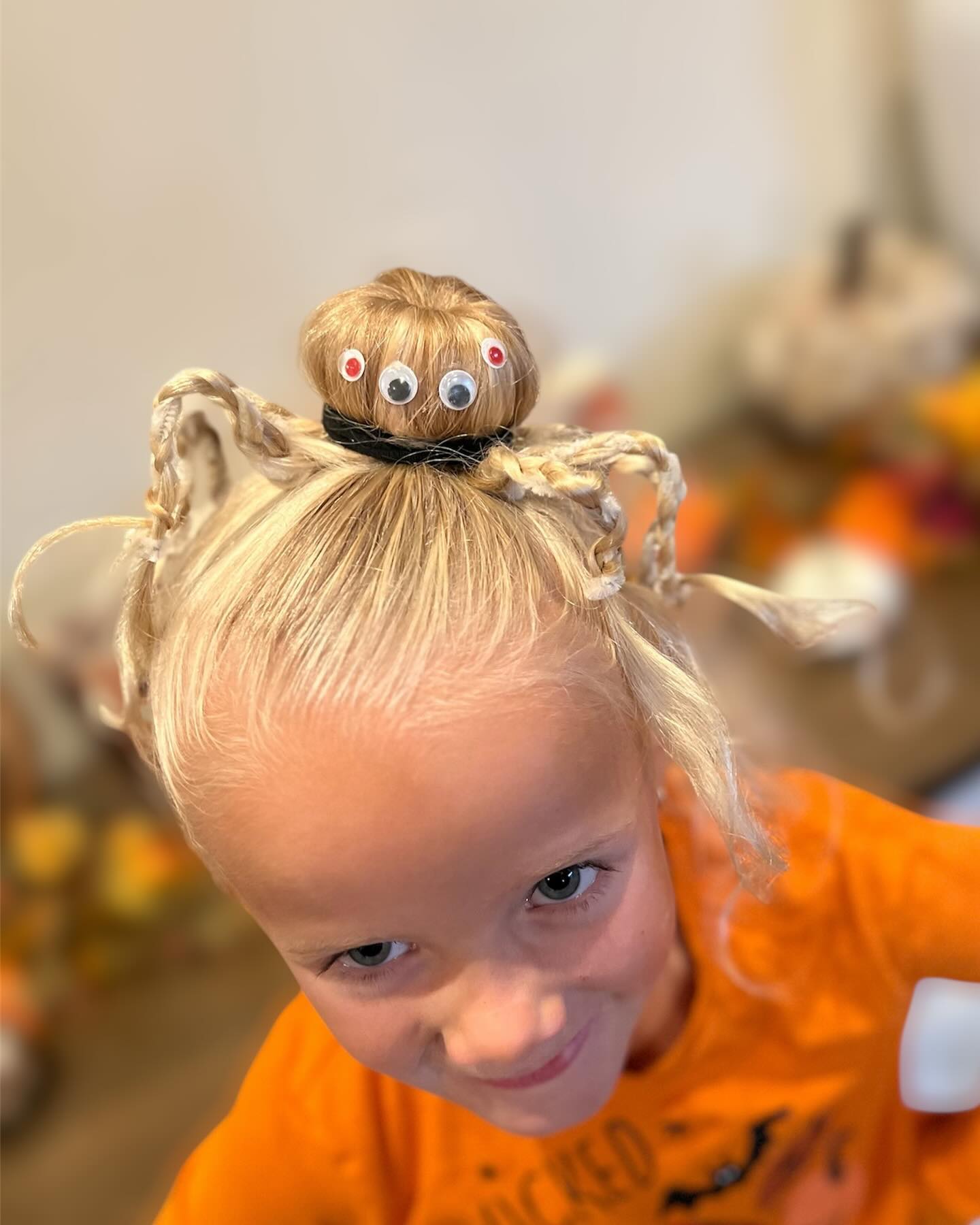 Spider Bun With Googly Eyes Halloween Hairstyle