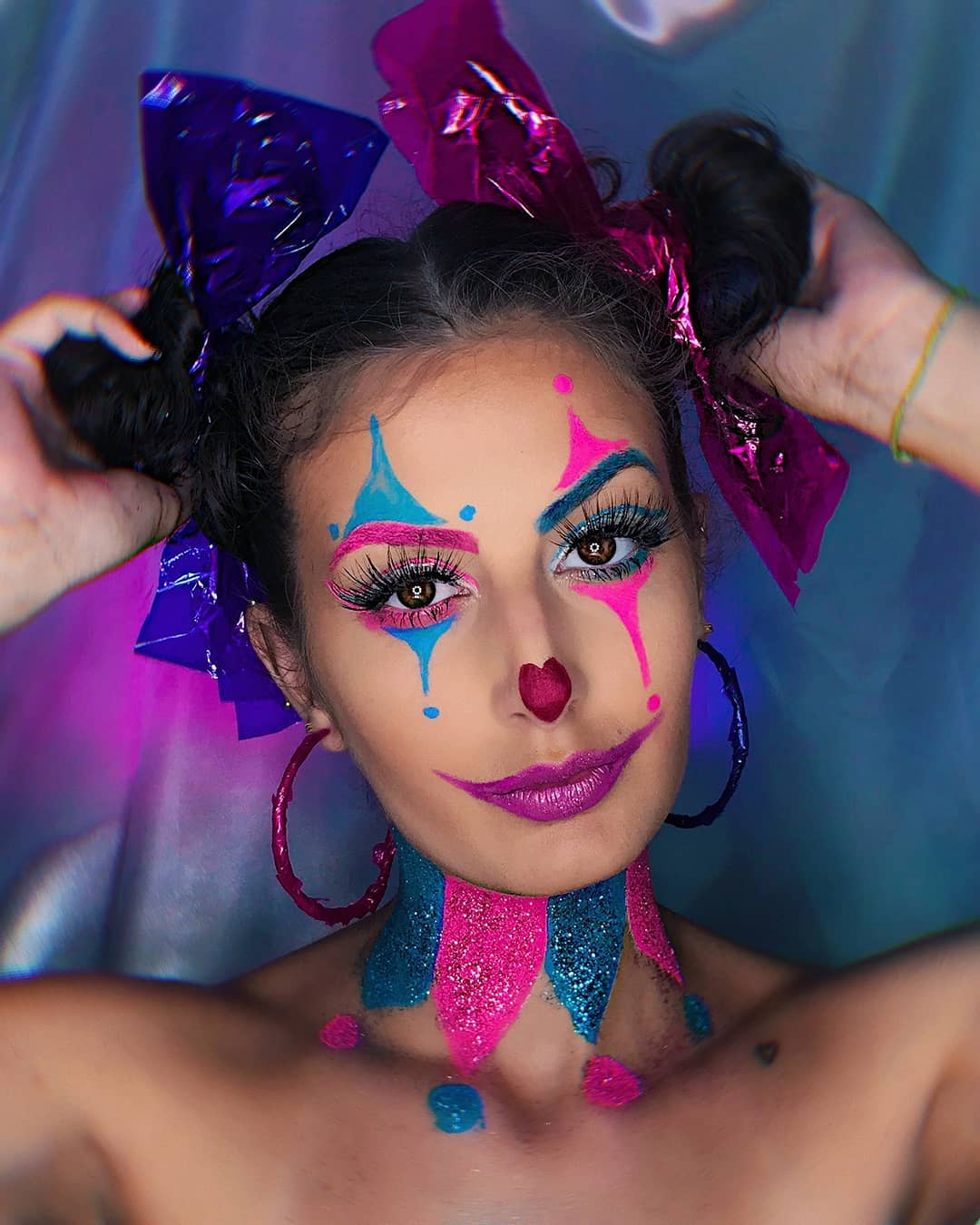 Whimsical Clown Pigtails With Metallic Bows