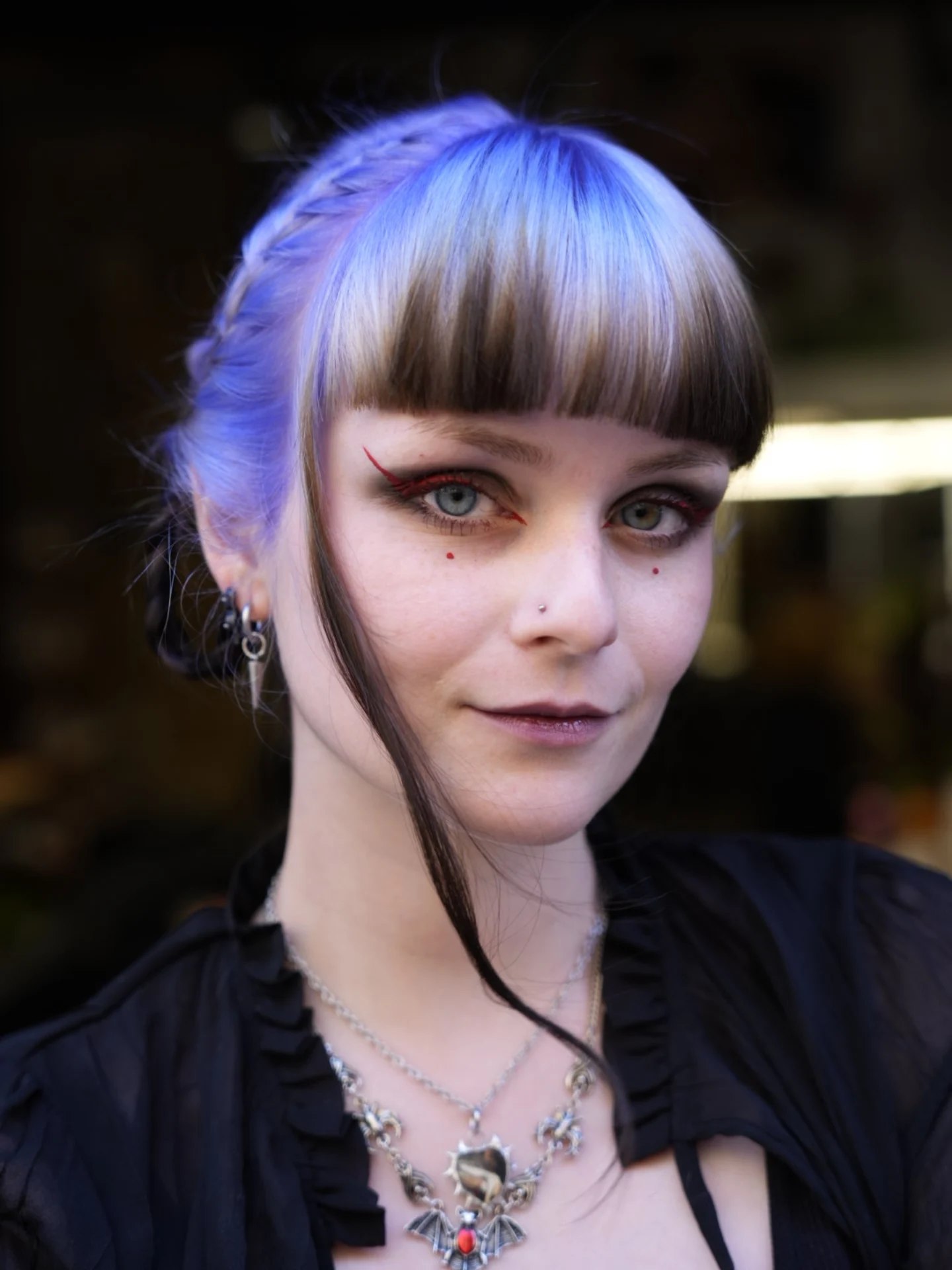 Electric Blue Braided Updo With Dark Bettie Bangs