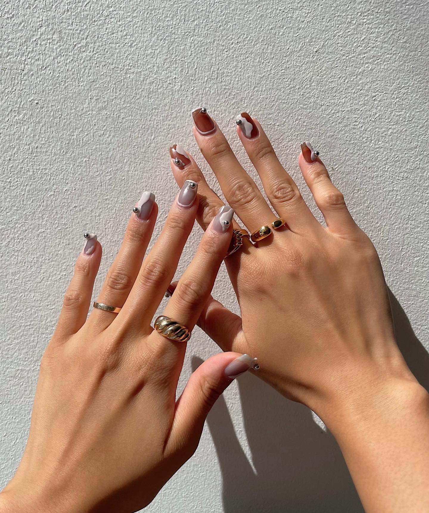 Asymmetrical French Tip with 3D Studs